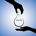silhouette-hand-holding-idea-bulb-100105459
